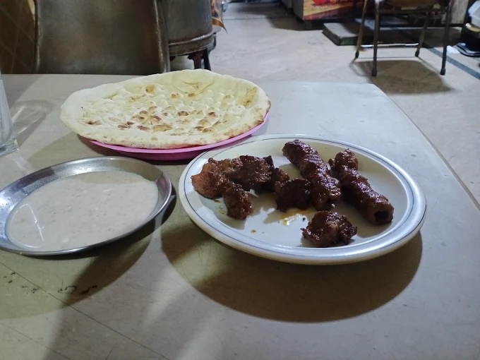Beef seekh kababs on grill at Shafi Tikka Shop