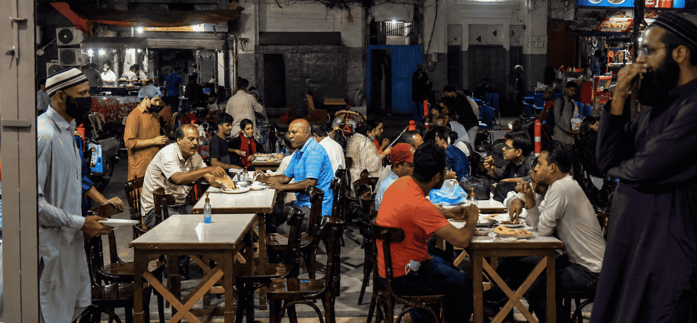 Crowded Burns Road Food Street in Karachi at night