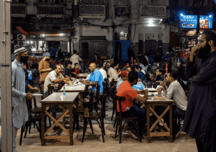 Crowded Burns Road Food Street in Karachi at night