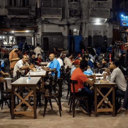 Crowded Burns Road Food Street in Karachi at night